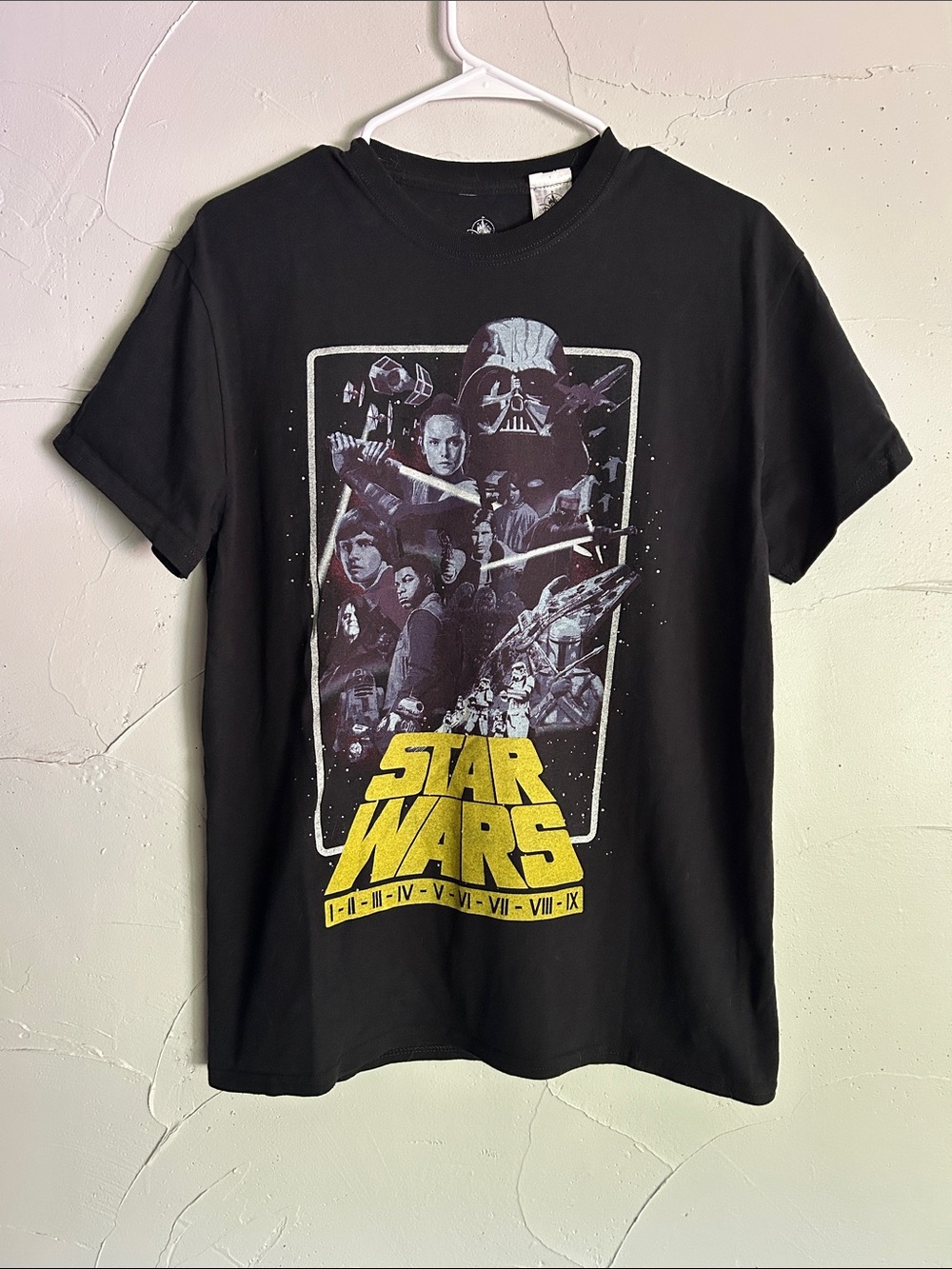 Star Wars Black Short Sleeve Tee with Yellow Logo and All Episodes Graphic